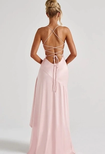 Detailed back view of a pink satin slip dress with criss-cross lace-up back design