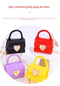 Detail view of mini jelly bags in four colors with gold heart buckles and chain straps