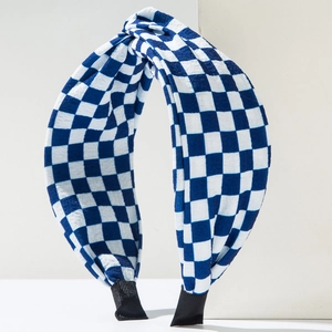 Detail of blue and white checkered fabric headband with stylish crossover twist design