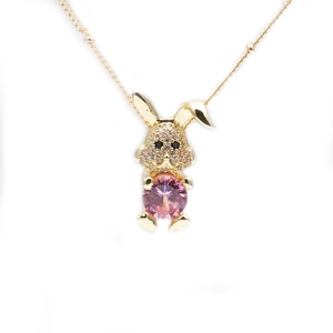Golden bunny pendant necklace with pink zircon gemstone and clear micro-pave crystals