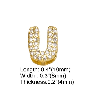 Macro detail of gold U-shaped pendant with cubic zirconia and size dimensions