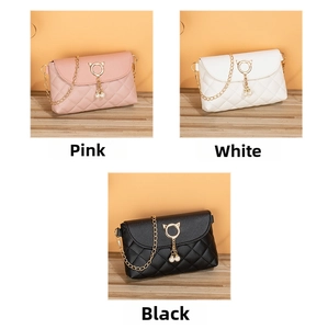 Detailed view of quilted mini chain bags in pink, white, and black with pearl charms