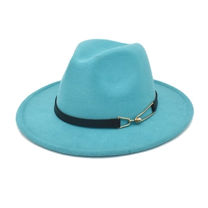 Detail of turquoise wool fedora hat featuring black leather band and gold metal buckle