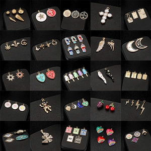Selection of 14K gold and enamel DIY charms including celestial and geometric designs