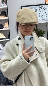 Detail view of beige retro ivy cap with button top and premium stitched panels