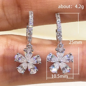 Elegant silver flower drop earrings with pear-cut crystals and pave-set cubic zirconia