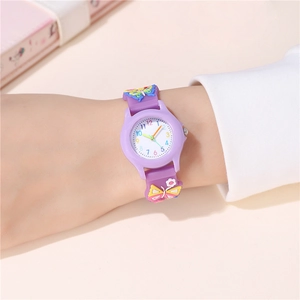 Close-up of children's purple watch featuring 3D butterfly silicone strap and numeric dial