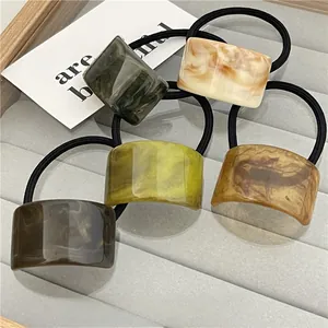 Detailed view of resin hair ties with marble texture and high elasticity rubber bands