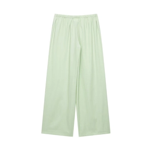 Detailed flat lay of light green wide-leg pants with comfortable elastic waistband