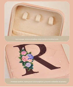 Pink PU leather jewelry box detail showing necklace hooks and waterproof outer shell