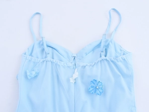 Detail of light blue floral strap dress featuring 3D flowers and invisible back zipper