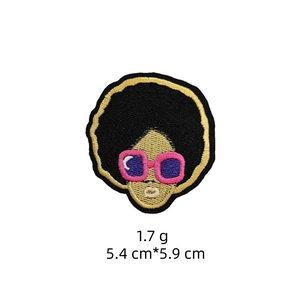 Detail view of cartoon girl embroidery patch with pink sunglasses, 5.4cm x 5.9cm size
