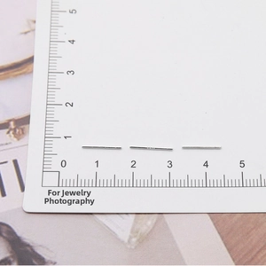 Detailed macro view of S925 sterling silver earrings posts with authentic S925 hallmarking