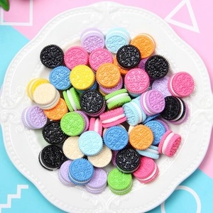 Close-up of colorful resin miniature Oreo-style cookie charms for DIY jewelry making