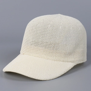 Detail of cream breathable knit baseball cap showing the mesh texture and curved brim