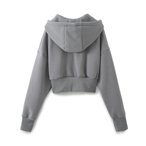 Back view of a gray cropped hoodie featuring textured fabric and ribbed hem details