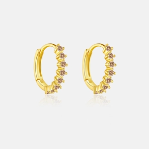 Detailed macro view of S925 silver gold earrings with champagne zircon stones