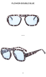 Detailed front and side view of tortoiseshell double bridge sunglasses with blue lenses