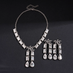 Chic silver geometric necklace and drop earrings set with HE letter details