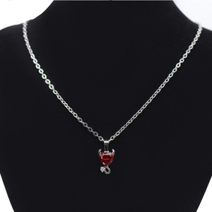 Devil heart pendant necklace with red zircon heart and silver chain on neck model