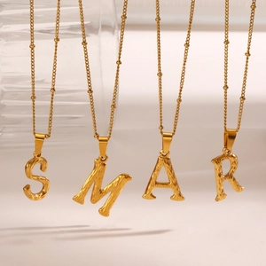 Gold stainless steel letter pendant necklace with hammered texture on beaded twist chain
