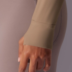 Macro detail of sun protection sports top cuff with functional thumbhole design