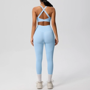 High-impact light blue yoga set with cross-back sports bra and high-waist leggings