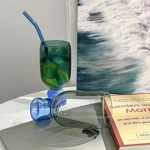 Colorful heat-resistant borosilicate glass cups with blue base and glass straws