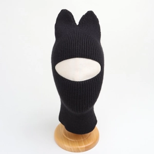 Detail of black knitted cat ear balaclava showing thick windproof texture and face mask