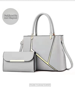 Detail of grey PU leather tote and matching long wallet with V-shaped gold metal trim