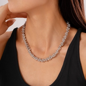 Minimalist silver geometric cluster bead necklace with a textured metallic finish