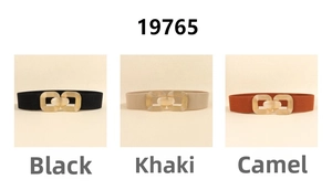 Close-up of elastic waist belts in black, khaki and camel with golden metal buckles