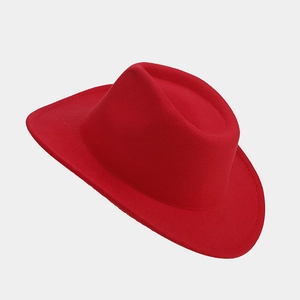 Detail of red wool felt cowboy hat with wide brim and classic Western pinched crown style