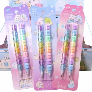 Close-up of Tuanzi Family multi-colored stackable bullet pencils in blister card packaging