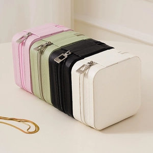 Portable leather jewelry organizer in four colors with a metallic zipper closure