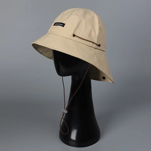 Detail of khaki outdoor bucket hat featuring neck flap, ripstop fabric and cord