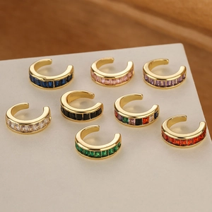 Close-up of eight 18K gold-plated ear cuffs with colorful rectangular zircon stones
