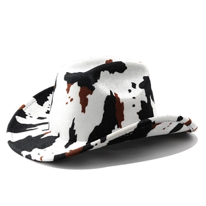 Detail of western cow print cowboy hat with wide brim and authentic felt texture