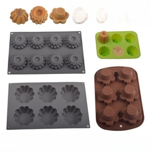 Detail view of multi-colored food-grade silicone baking molds with floral textures