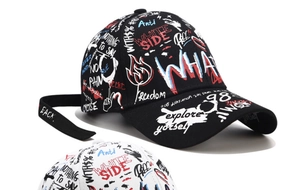 Detail shot of the long adjustable strap on a graffiti pattern baseball cap