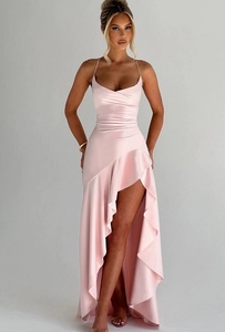 Close-up of pink satin slip dress featuring V-neckline and ruffled high slit detail
