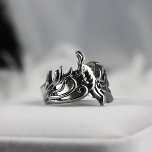 Detailed close-up of a vintage phoenix relief pattern on a titanium steel ring for men