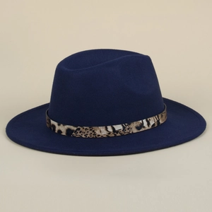 Detailed texture of navy blue fedora hat featuring a classic leopard print belt strap