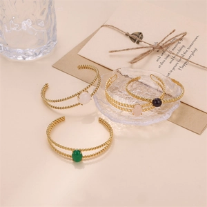 Vintage stainless steel open bangle with colorful natural stones in a lifestyle setting