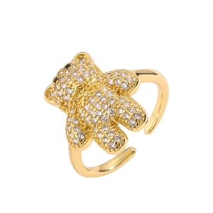 Adjustable gold plated bear ring featuring full pavé zircon stones on white background