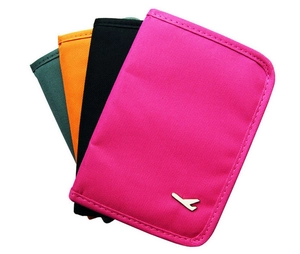 Detail view of four multi-colored travel passport organizers with minimalist plane icon