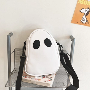 Close-up of cute white ghost-shaped PU leather crossbody bag with black eye details