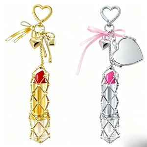 Lipstick case bag charm with heart carabiner and ribbon bow in gold and silver