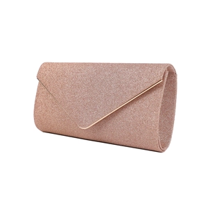 Detailed side view of a rose gold glitter envelope clutch with metallic trim and V-flap
