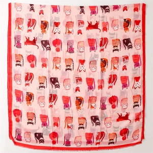 Flat lay of soft pink cotton scarf with cute cartoon cat prints and red borders